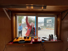 Microsoft volunteer painting at the developing Salmon Bay Tiny House Village and RV Safe Lot
