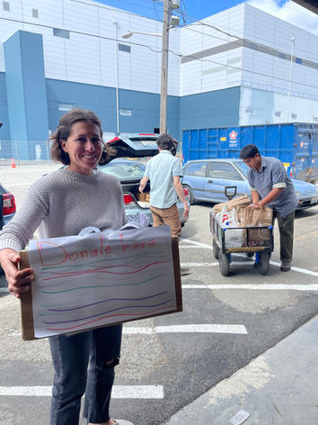 Teachers from Westside School bring in new toiletries, socks, and underwear collected by their 3rd grade class